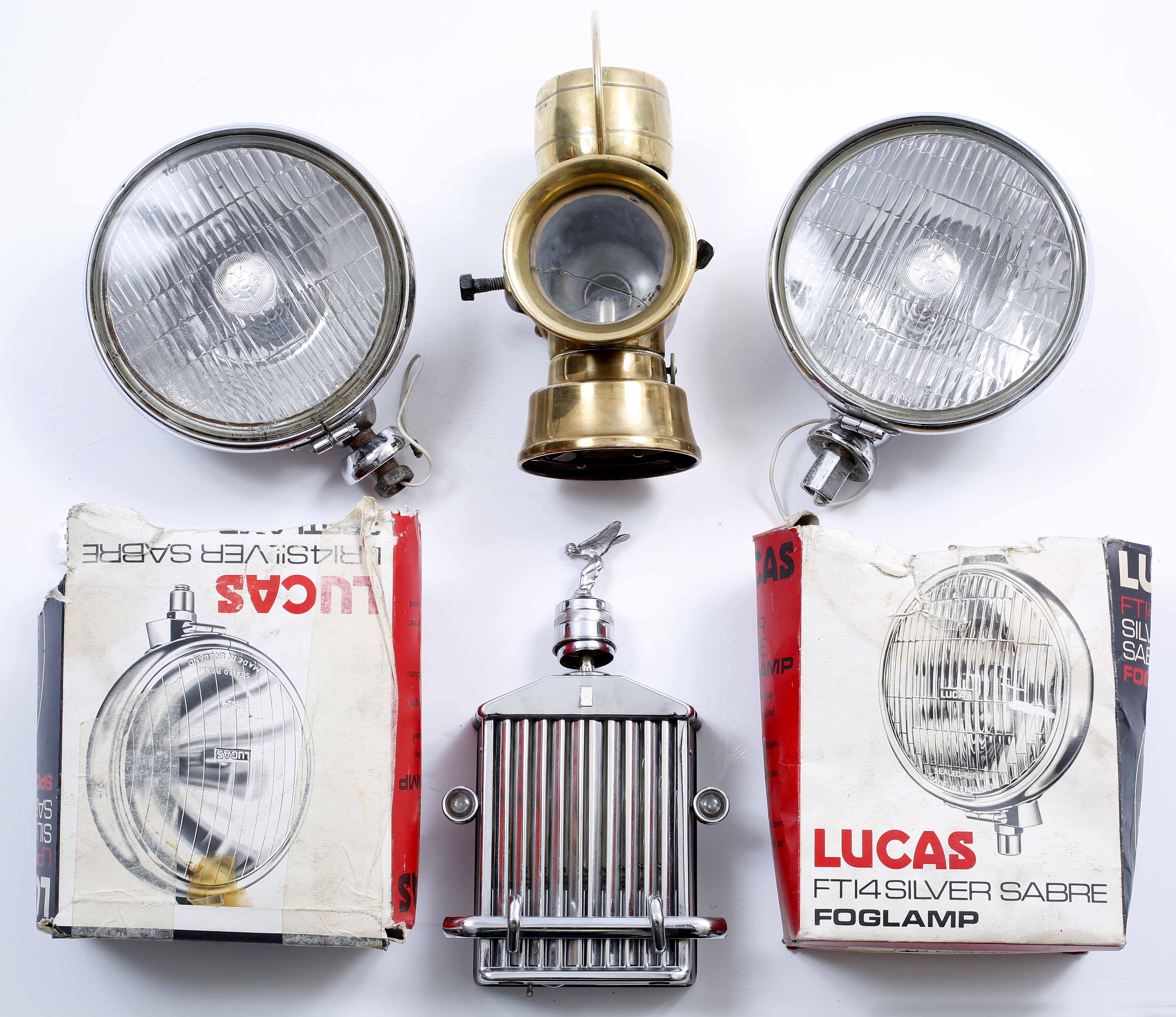 TWO LUCAS HEADLAMPS each 18cm diameter, a Lucas no. 624 Road King brass lantern, 26cm in height; and