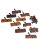 A SELECTION OF OAK CARPENTERS PLANES including Shepley & Brain example