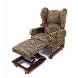 AN OAK EARLY 20TH FOOT'S RECLINING WING BACK ARMCHAIR with adjustable stool and drinks stand 74cm