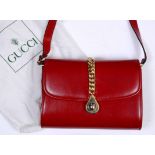 A GUCCI RED LEATHER HANDBAG in original cloth bag, 20cm wide