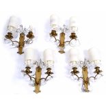 A SET OF FOUR BRASS AND CUT GLASS TWO BRANCH WALL LIGHTS, 27cm high