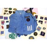 A 1950'S GIRL GUIDES BLOUSE with badges