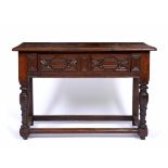 AN ANTIQUE OAK SIDE TABLE with mitered decoration to the single long frieze drawer, 121cm wide x