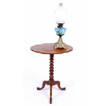 A VICTORIAN TILT TOP TRIPOD TABLE 58cm wide together with an old oil lamp 58cm high (2)