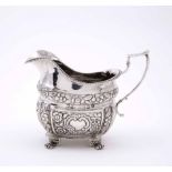 A REGENCY IRISH SILVER MILK JUG marks for Dublin 1821, retailers mark of Edward Twycross and