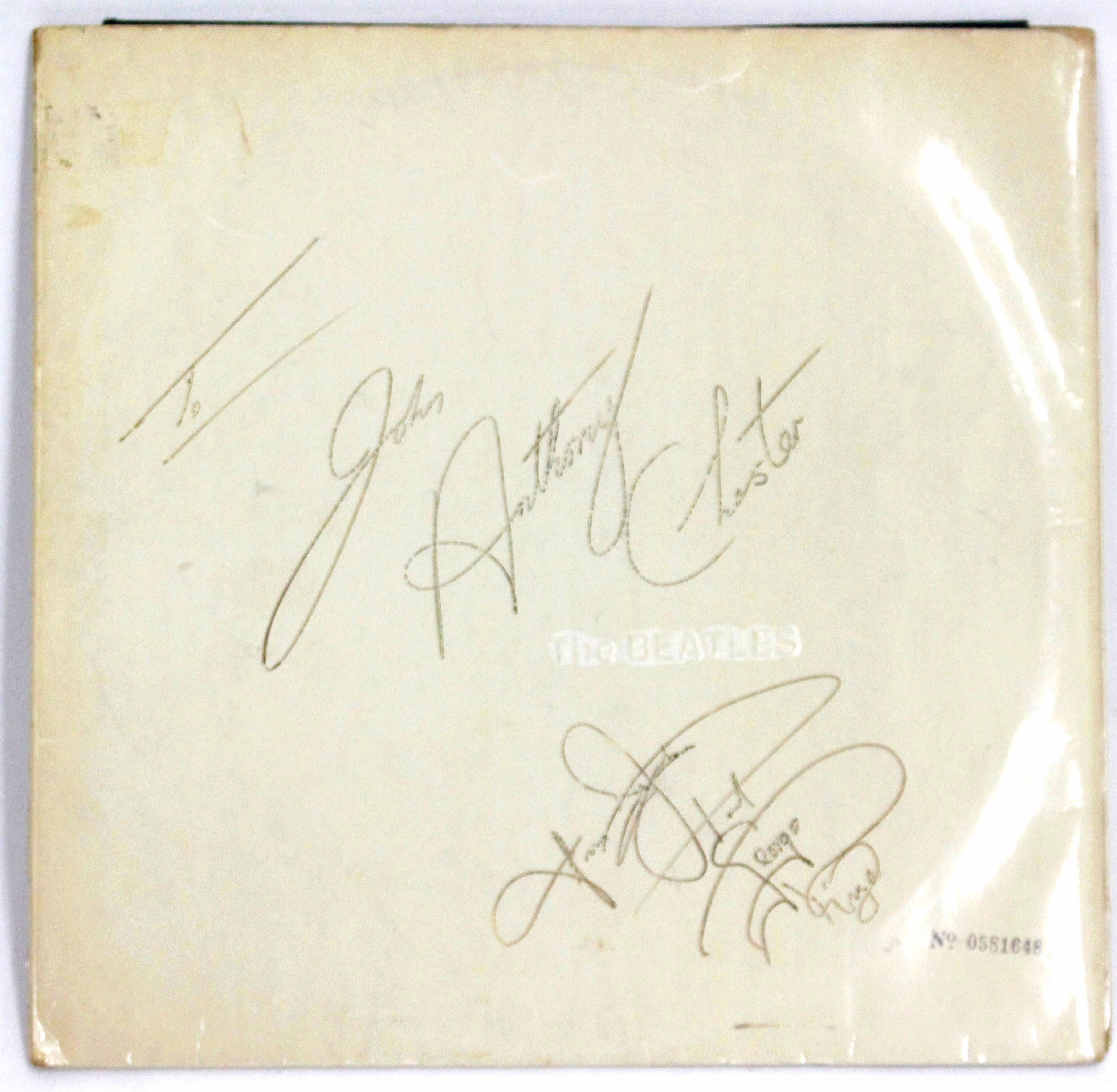 BEATLES WHITE ALBUM numbered 0581648 inscribed to John Anthony Chester and signed by The Beatles