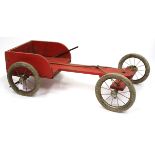 AN EARLY 20TH CENTURY HAND PAINTED RED CHILD'S TROLLEY