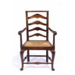 A 19TH CENTURY NORTH COUNTRY WALNUT LADDER BACK OPEN ARMCHAIR with scrolling arms, 66cm wide