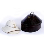 A LATE 19TH / EARLY 20TH CENTURY WELSH PITH GUARDSMAN'S HELMET and original tin, makers label to the