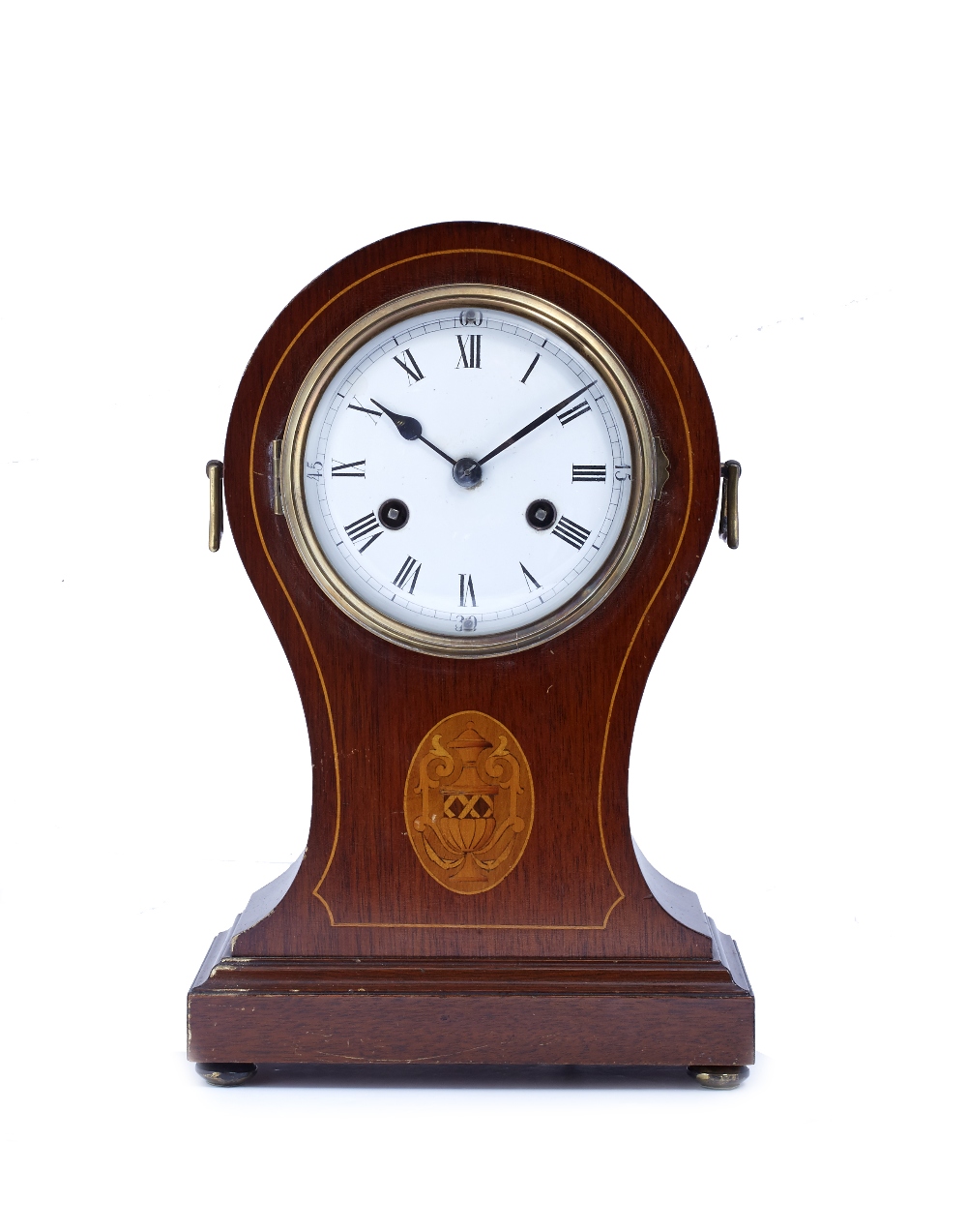 A mahogany and inlaid balloon cased mantel clock with convex white enamel Roman dial, the twin train