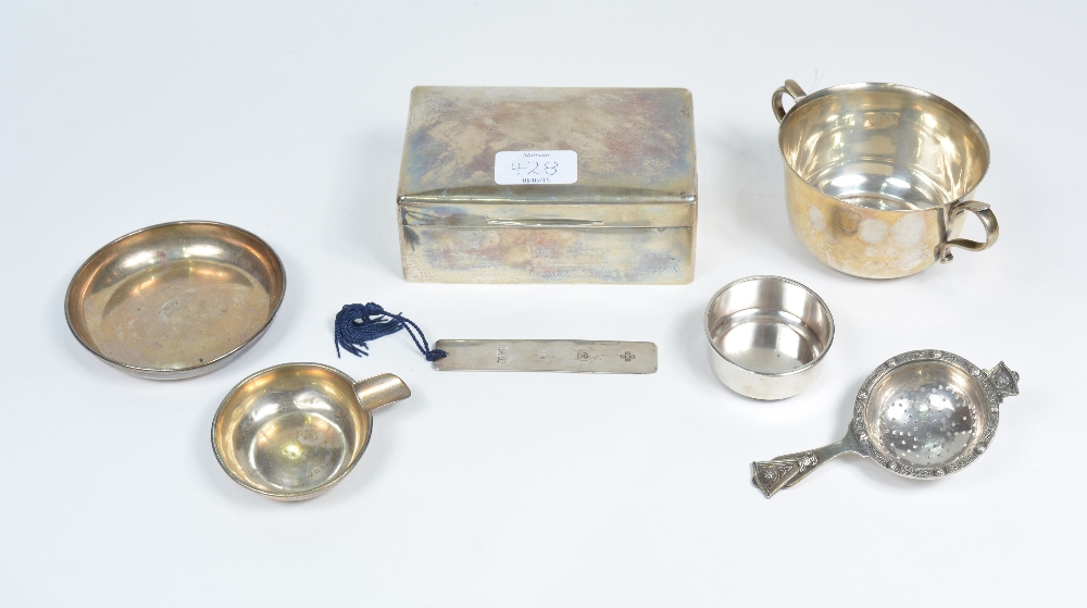 A small collection of miscellaneous silver wares including a silver porringer, a silver ashtray, a