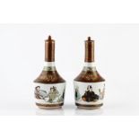 A pair of Japanese Kutani sake bottles and stoppers late Meiji period decorated with six seated