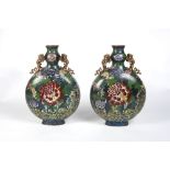 A pair of large Chinese cloisonne moon flasks 19th Century with allover flower and leaf designs,