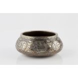 A Mamluk engraved brass bowl late 19th century, Egypt or Syria of oval shape with sloping walls,