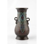 A Japanese bronze and cloisonne archaic style vase 19th Century with palmette design and ring