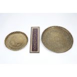 Two brass Ottoman petal-edged trays each embossed with scripture and foliate patterns, 46cm and 31cm