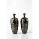 A pair of Japanese cloisonne vases Meiji period signed, decorated with wisteria on dark blue ground,