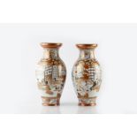 A pair of Japanese Kutani vases late 19th Century two interior scenes, signed, 30.5cm