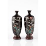 A pair of Japanese black ground cloisonne vases Meiji each decorated with blossom, 15cm high, with