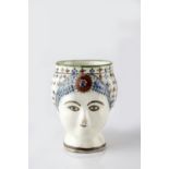 A Persian fritware mug Qajar dynasty, 19th Century in the form of a the head of a woman wearing a