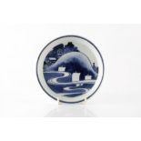 A Japanese Shoki blue and white Imari dish mid-late 17th Century decorated with boats on the water