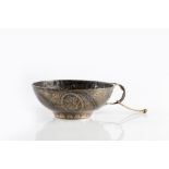 A Persian silver metal plated cup 19th century with leaf shaped handle and engraved medallions