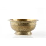 A Persian gilt metal/brass bowl 18th/19th Century with engraved foliate decoration, 27cm