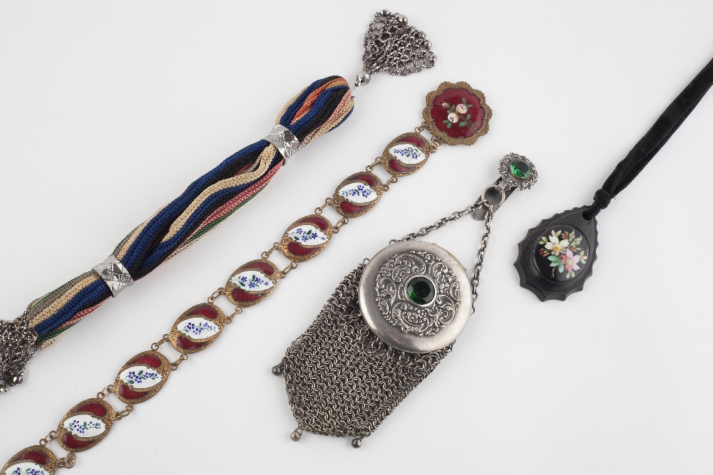 An enamel and gilt metal belt, circa 1900, the oval panels decorated with forget-me-not flowerhead