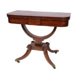 A REGENCY MAHOGANY FOLD OVER CARD TABLE with inlaid decoration on hoop support and four splay legs