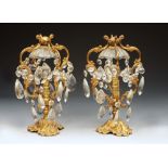 A PAIR OF GILT METAL TABLE LAMPS, each with four scrolling shaped arms uniting at the top and hung