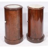 TWO VICTORIAN MAHOGANY CYLINDRICAL POT CUPBOARDS with panelled doors and inset white marble tops,