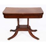 A REGENCY MAHOGANY AND EBONY LINE INLAID FOLD OVER CARD TABLE with green baize playing surface and