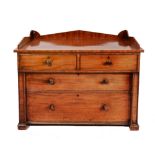 A LATE GEORGIAN MAHOGANY DRESSING CHEST of two short and two long drawers with galleried top and