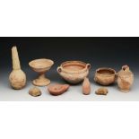 A GROUP OF CLAY ANTIQUITIES to include a stem cup, two bowls, two masks, a ribbed vase with tapering