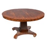 A MID VICTORIAN FIGURED MAHOGANY AND CROSSBANDED CIRCULAR BREAKFAST TABLE, the tilt top on