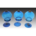 A SET OF THREE BLUE GLASS CEILING LIGHTS OF LOBED FORM with metal mounts, approximately 25cm (some