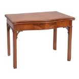 A GEORGE III MAHOGANY SERPENTINE FRONTED CARD TABLE, with baize inset fold over top, having