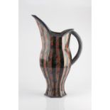 Ross Emerson (British, Contemporary) Jug striped pattern in orange and blue incised signature 53.5cm