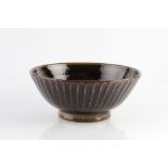 Edward Hughes (British, 1953-2006) Bowl fluted, tenmoku and ash glaze impressed potter's seal 12.5cm