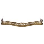 A LATE GEORGIAN PIERCED BRASS SERPENTINE FENDER with gadrooned edge, 167cm long