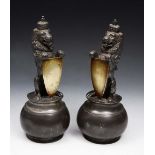 A PAIR OF VICTORIAN PEWTER SPOON WARMERS each in the form of an heraldic crowned lion, with