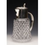 A LARGE CUT GLASS CORDIAL JUG with silver plated mounts, handle and liner, 30cm high