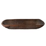 AN OLD TONGAN FEASTING BOWL with rounded ends and simple cut carrying handles, 171 x 69cm