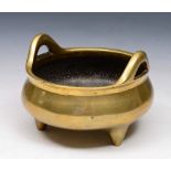 AN 18TH/19TH CENTURY CHINESE BRONZE DING with Xuande mark of plain form with twin handles, 12cm