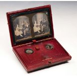 A MID 19TH CENTURY STEREOSCOPIC DAGUERREOTYPE VIEWER, the burgundy leather folding case stamped '