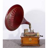 A WIND UP GRAMOPHONE with red lacquered horn and labelled 'Everything Under the Sun', registered