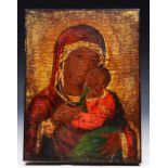 AN ORTHODOX ICON portraying the Virgin Mary and Child with gilded and polychrome decoration,