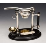 A MAPLES & CO CITRUS FRUIT SQUEEZER with silver plated mounts and on ebonised stand, Registered