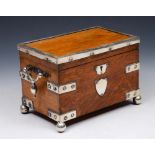 A LATE VICTORIAN OAK TEA CADDY with twin divisional interior enclosed by hinged rising lid with