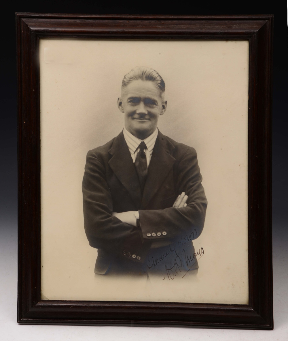 A FRAMED PHOTOGRAPH of Lord Nuffield. signed "sincerely yours W.R. Morris."